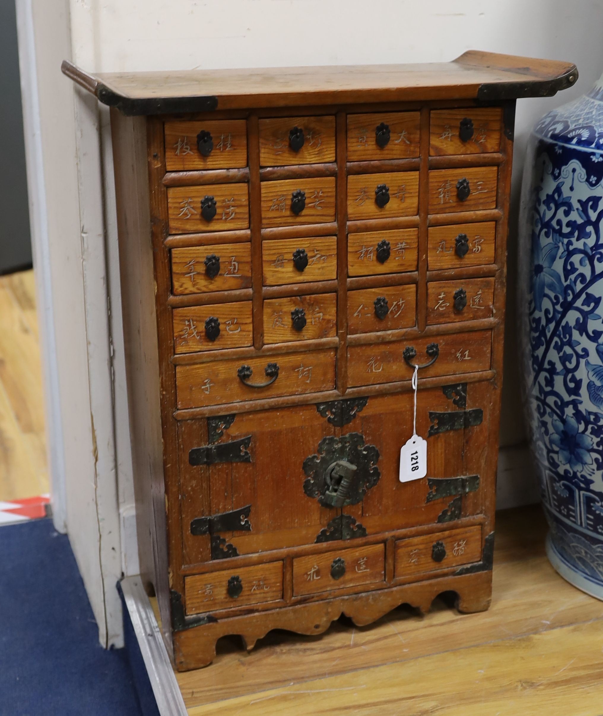 A small Chinese elm medicine chest, width 50cm, depth 24cm, height 66cm